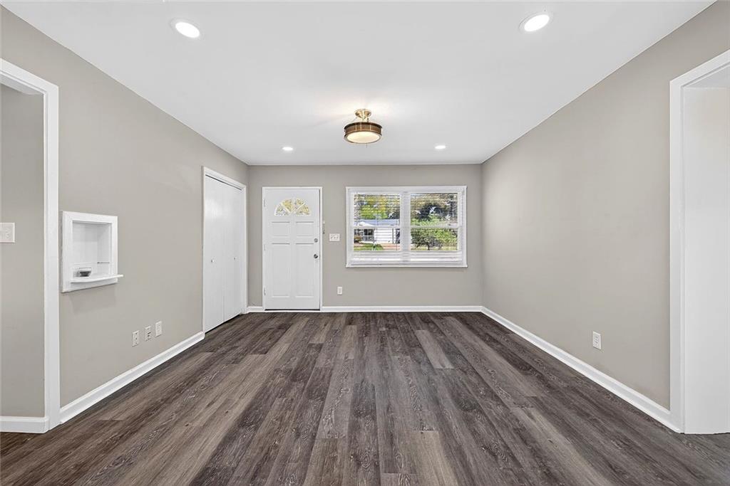 3045 Lindon Lane Decatur, GA 30033 - Photo 6 of 18 an empty room with wooden floor and windows