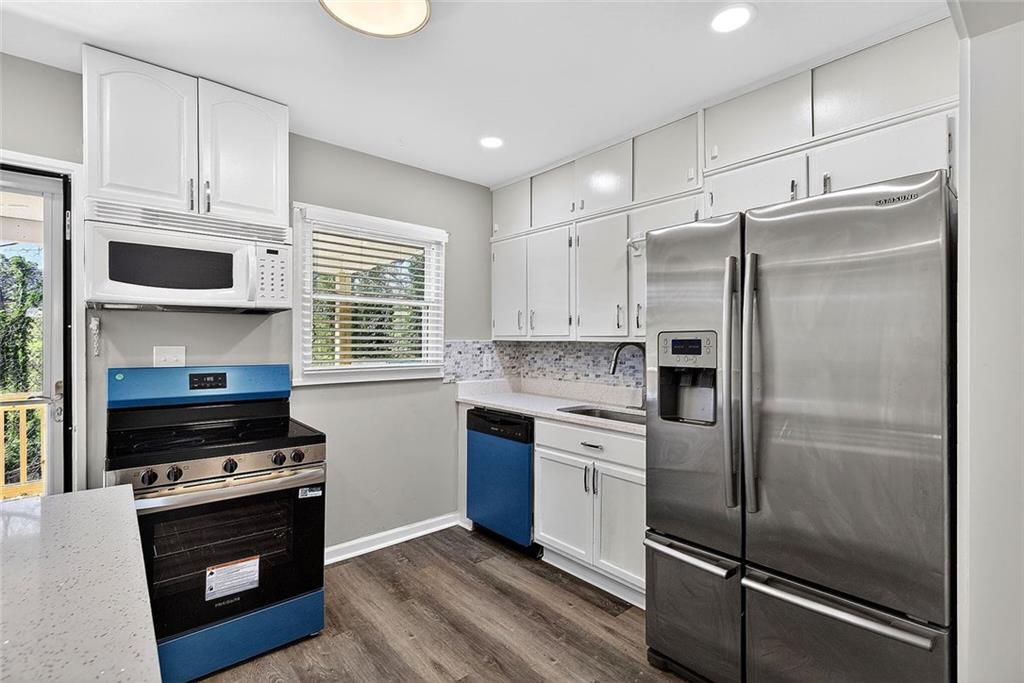3045 Lindon Lane Decatur, GA 30033 - Photo 10 of 18 a kitchen with stainless steel appliances a refrigerator stove and microwave