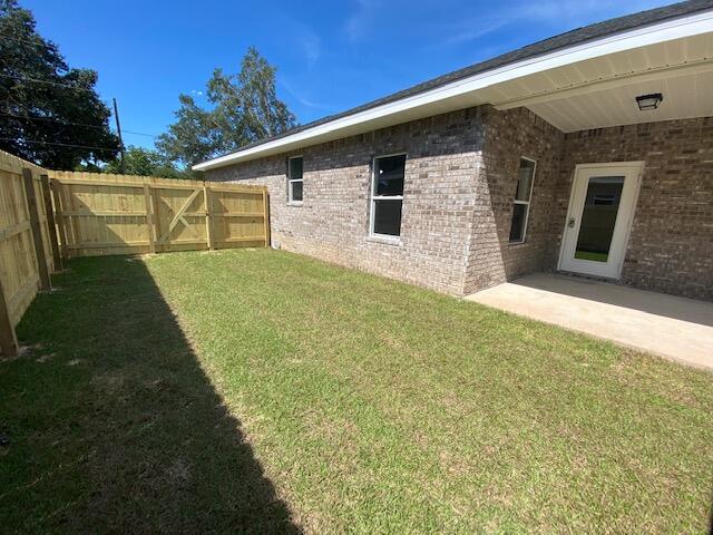 519 Friendship Road Mary Esther, FL 32569 - Photo 31 of 47 a backyard of a house with table and chairs