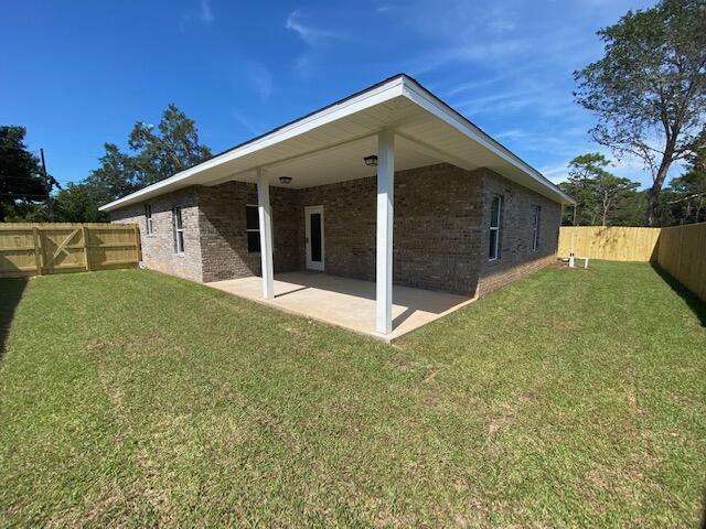 519 Friendship Road Mary Esther, FL 32569 - Photo 33 of 47 a front view of a house with a yard