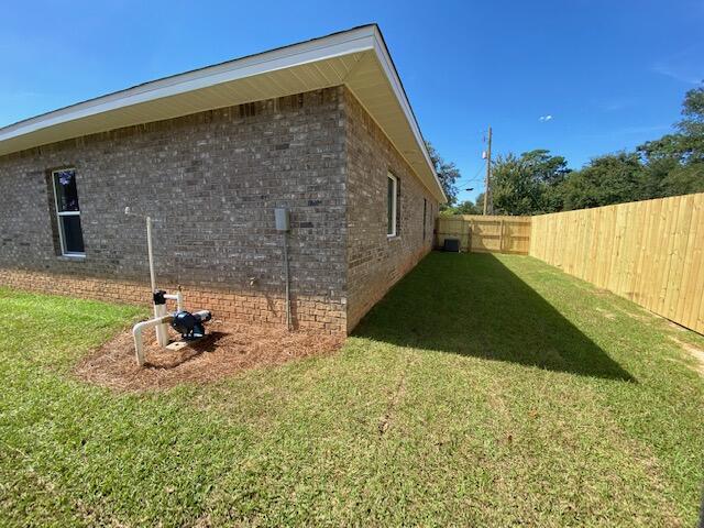 519 Friendship Road Mary Esther, FL 32569 - Photo 34 of 47 a backyard of a house with seating space