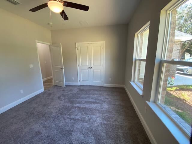 519 Friendship Road Mary Esther, FL 32569 - Photo 38 of 47 an empty room with windows and entrance