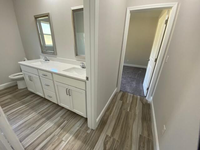 519 Friendship Road Mary Esther, FL 32569 - Photo 40 of 47 a bathroom with a double vanity sink and mirror