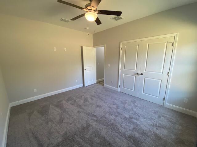 519 Friendship Road Mary Esther, FL 32569 - Photo 46 of 47 an empty room with a ceiling fan and a closet
