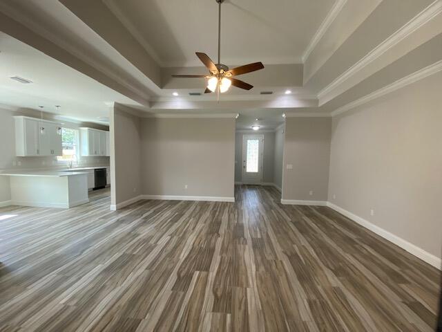 519 Friendship Road Mary Esther, FL 32569 - Photo 6 of 47 a view of empty room with wooden floor and fan