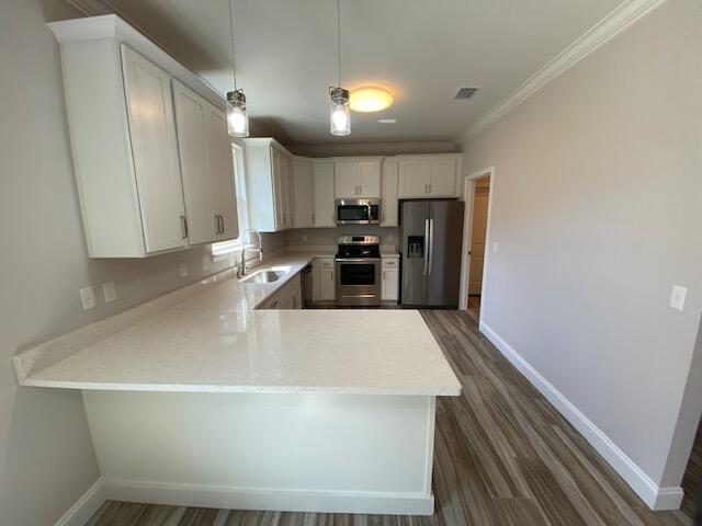 519 Friendship Road Mary Esther, FL 32569 - Photo 8 of 47 a large kitchen with a sink a refrigerator and a stove