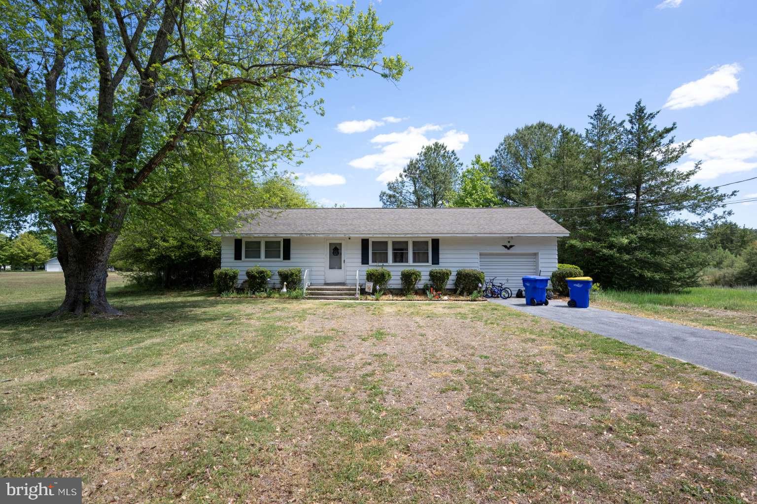 37186 Clubhouse Road Ocean View, DE 19970 - Photo 14 of 14 front view of a house with a big yard