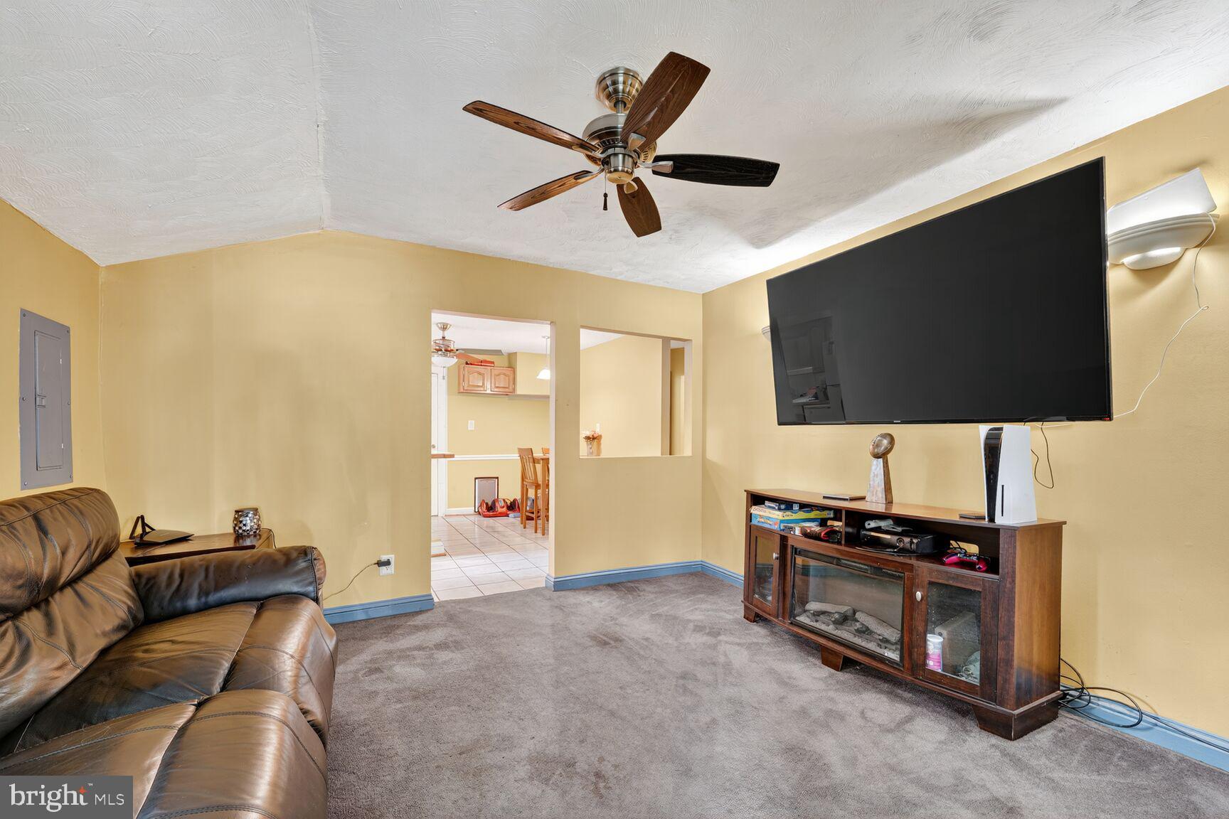 1001 Iago Avenue Capitol Heights, MD 20743 - Photo 3 of 13 a living room with furniture and a flat screen tv