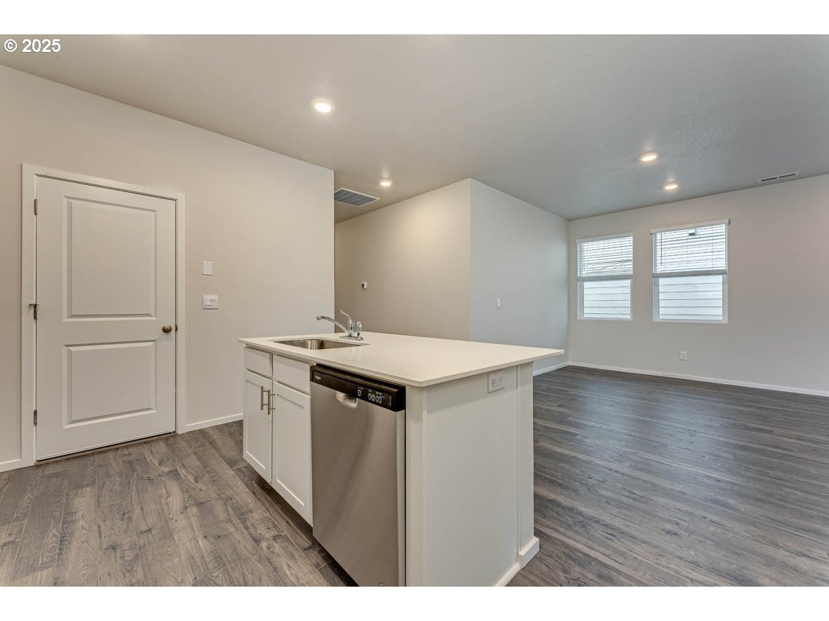 2897 U Street Springfield, OR 97477 - Photo 13 of 26 a kitchen with a sink and wooden floor