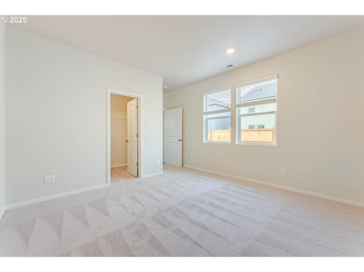 2897 U Street Springfield, OR 97477 - Photo 23 of 26 a view of an empty room with wooden floor and a window