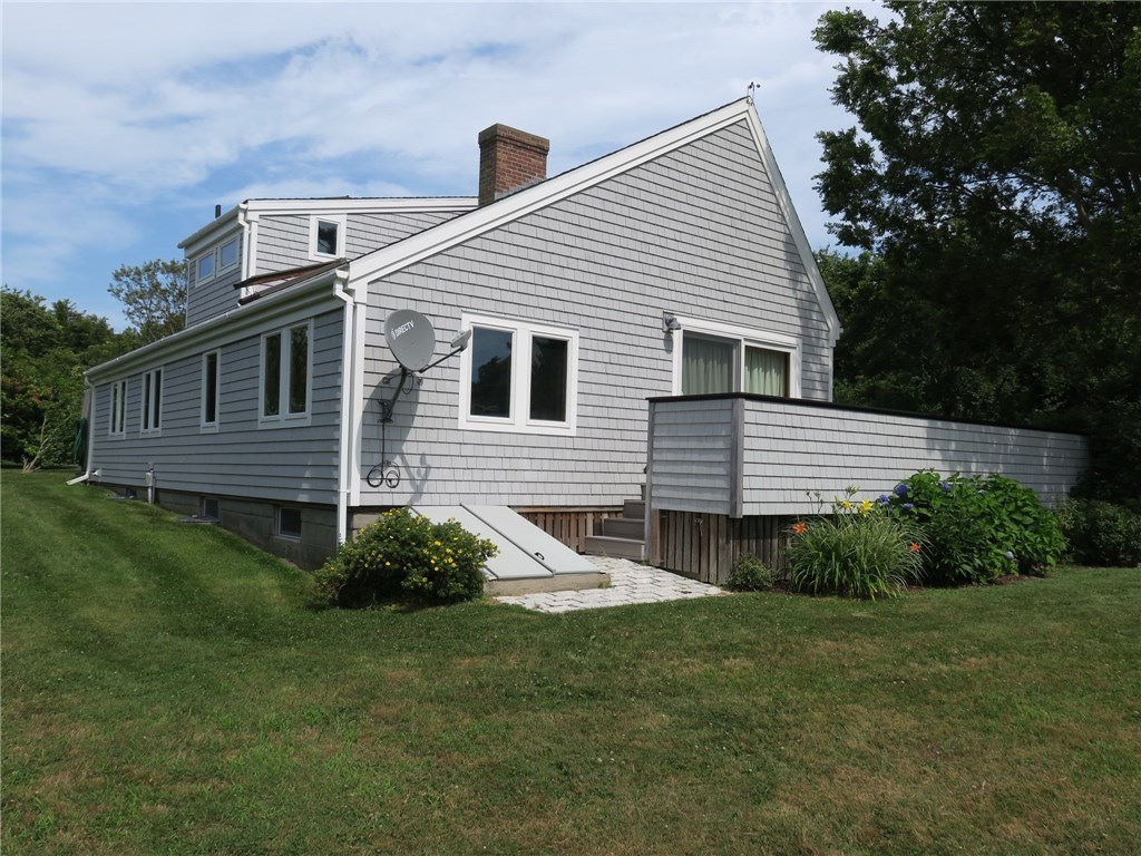 665 Ministers Path Block Island, RI 02807 - Photo 5 of 19 West exterior with bulkhead to basement