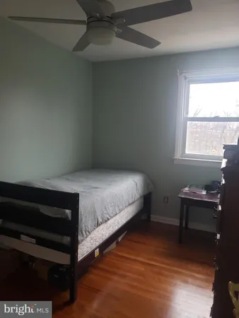 a room with furniture wooden floor and window