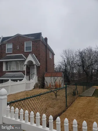 a front view of houses with yard
