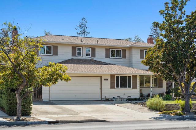 a front view of a house with a yard