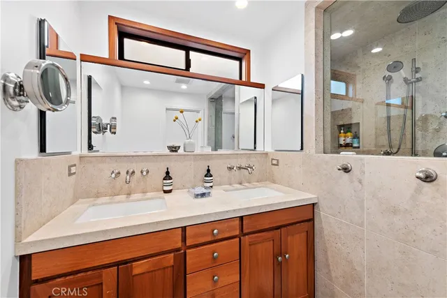 a bathroom with a sink vanity and a mirror
