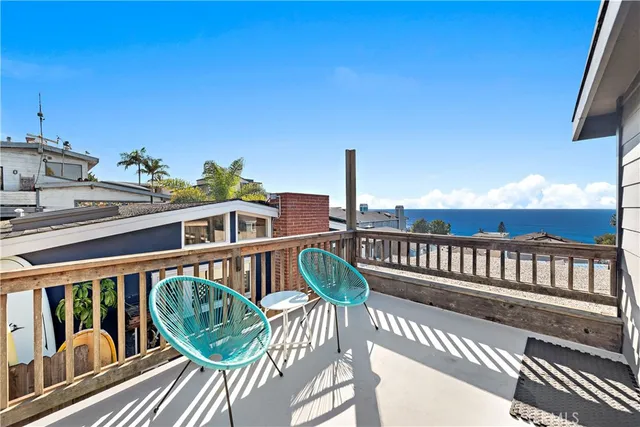 a view of a balcony with wooden floor