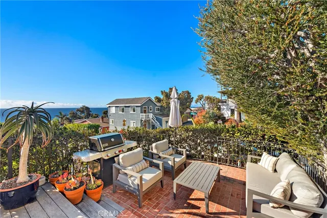 a view of a chairs and table on the terrace
