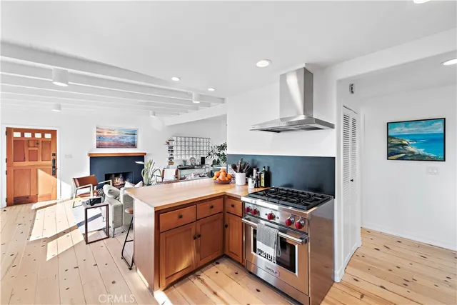 a kitchen with a stove oven and sink