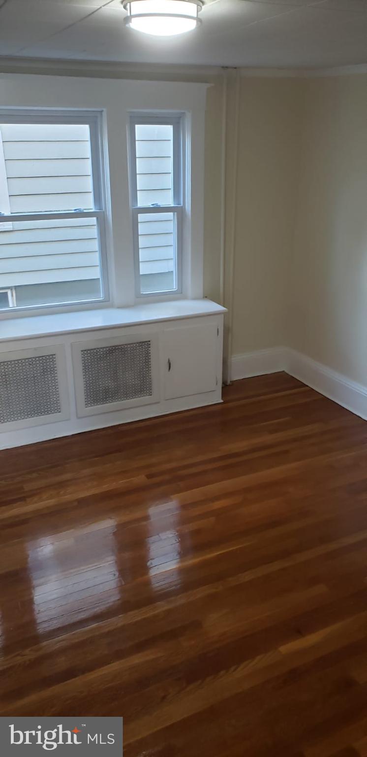 2931 Nottingham Way Hamilton, NJ 08619 - Photo 7 of 19 a view of wooden floor and windows in a room