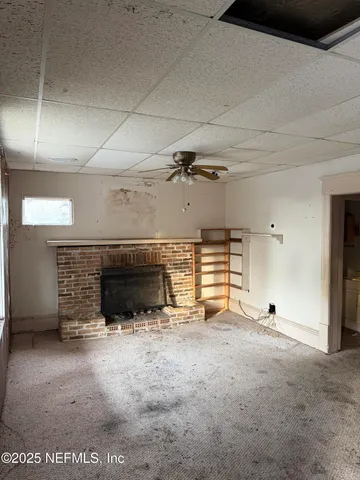 a view of a livingroom with a fireplace