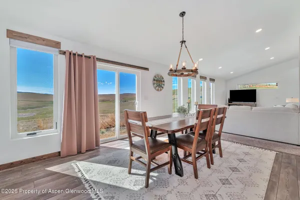 a view of a dining room with furniture