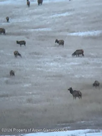 a view of a balcony with furniture