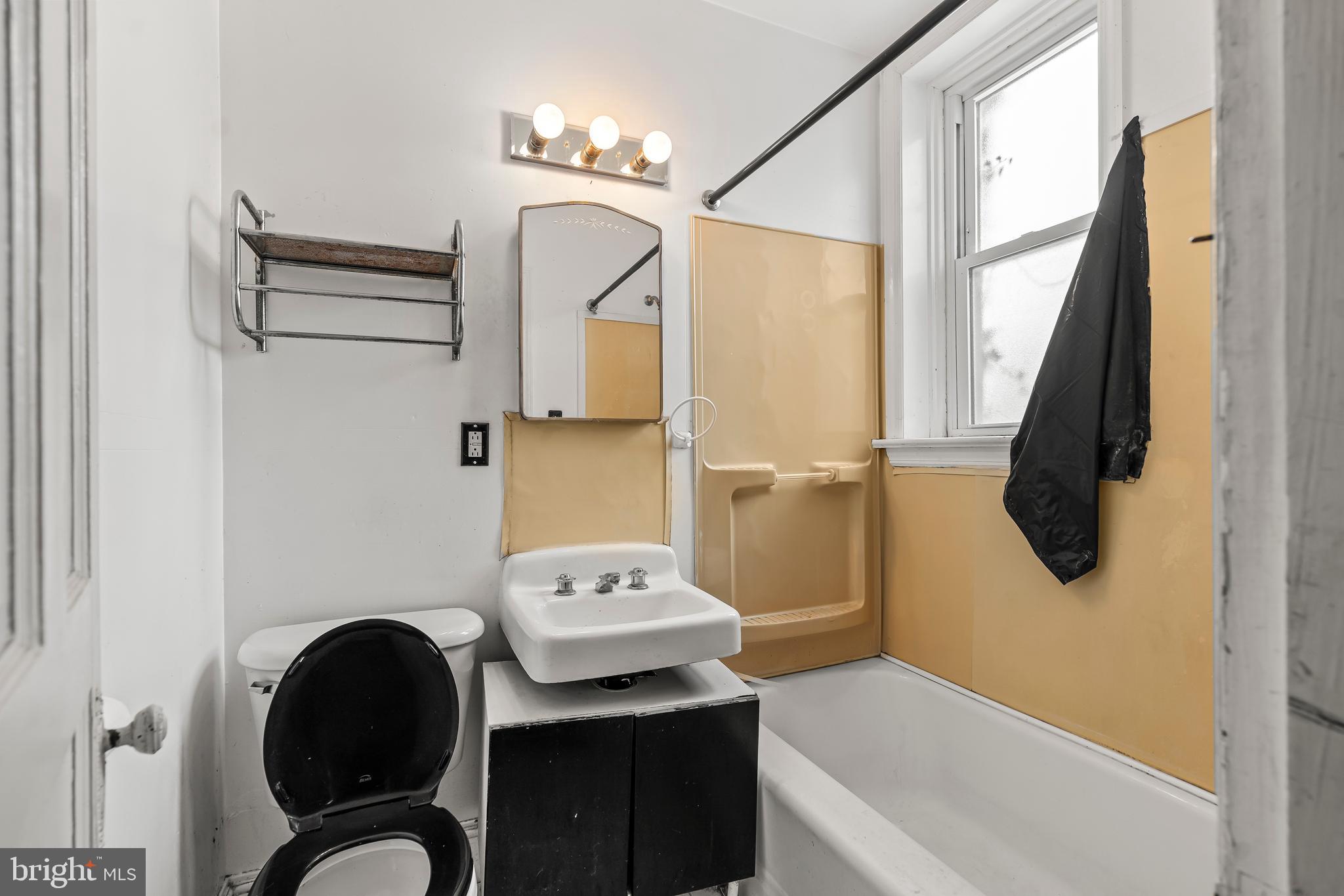 767 Spruce Street Hagerstown, MD 21740 - Photo 13 of 36 a bathroom with a sink and a mirror