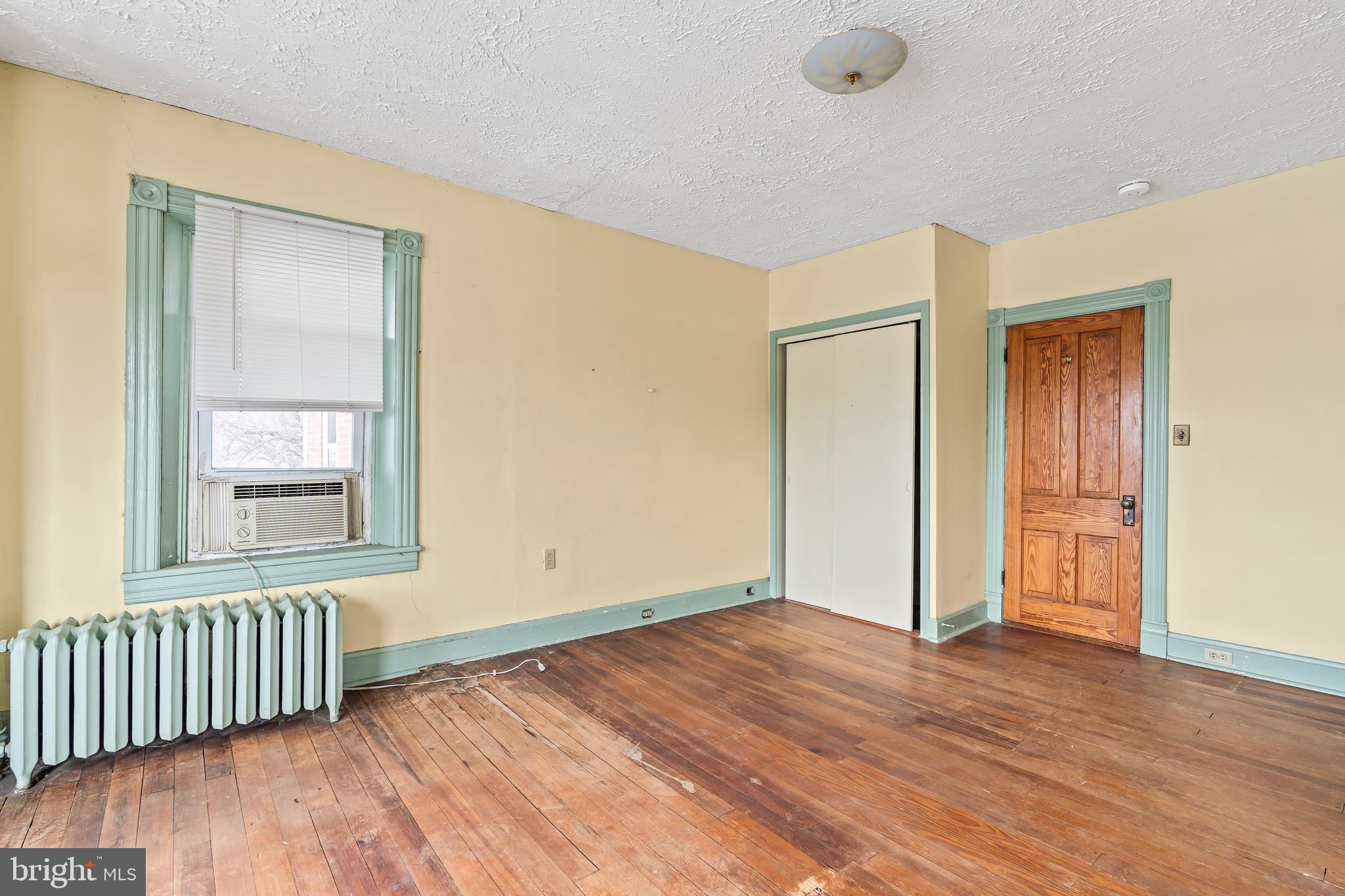 767 Spruce Street Hagerstown, MD 21740 - Photo 16 of 36 a view of an empty room with wooden floor and a window