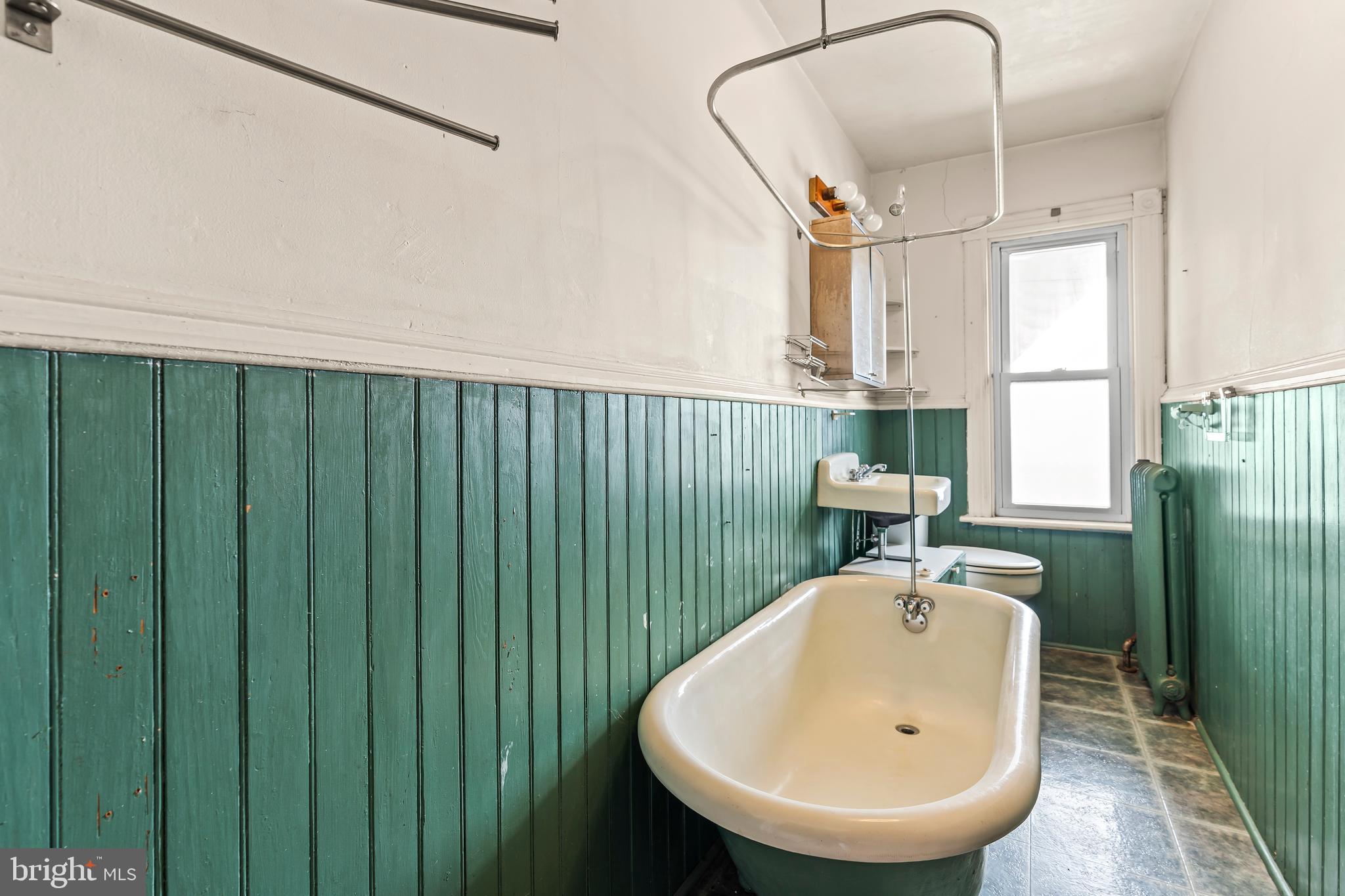 767 Spruce Street Hagerstown, MD 21740 - Photo 28 of 36 a bathroom with a sink a mirror and a window