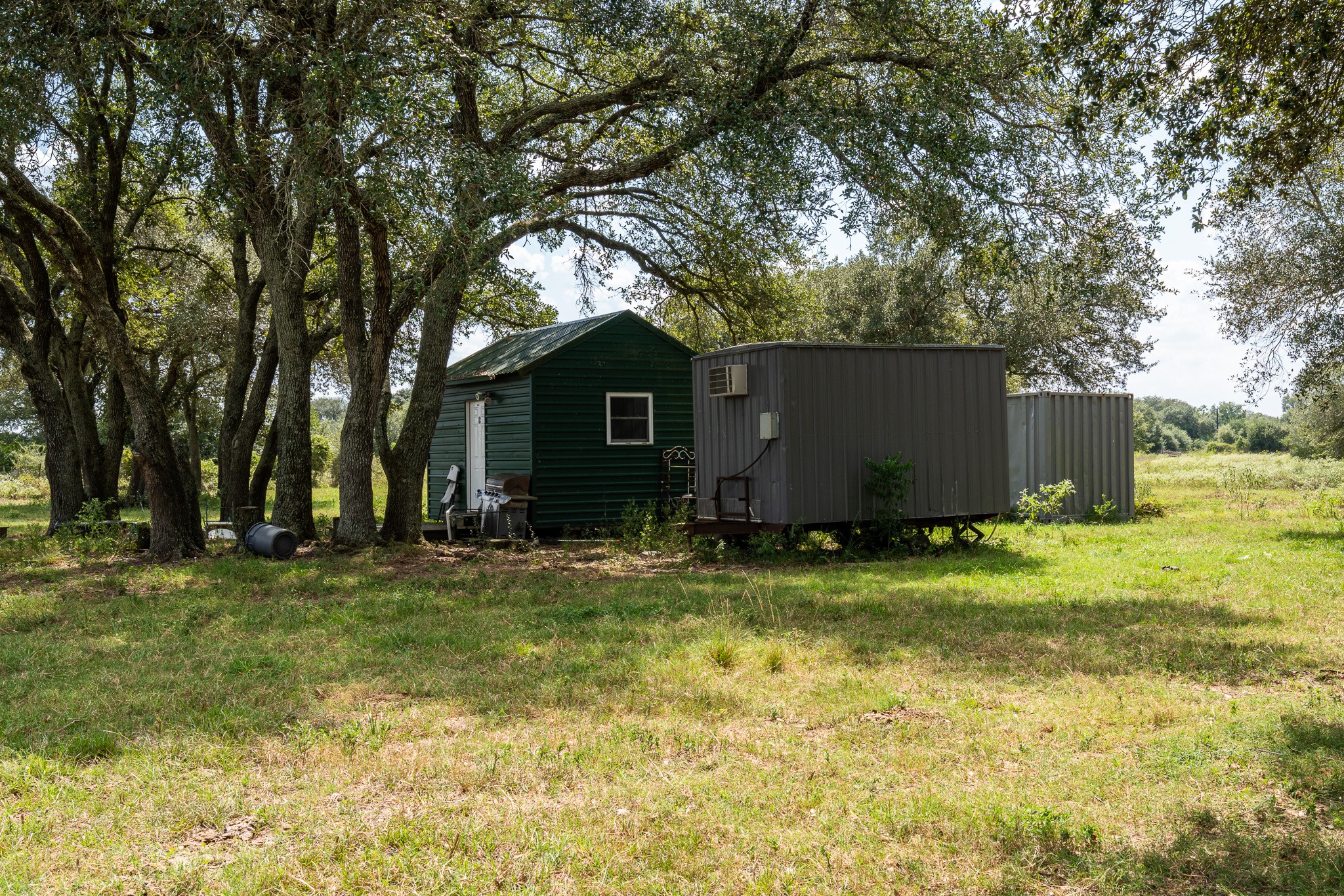106 Cr 106 Road Rock Island, TX 77470 - Photo 21 of 29 a backyard of a house with yard and trampoline