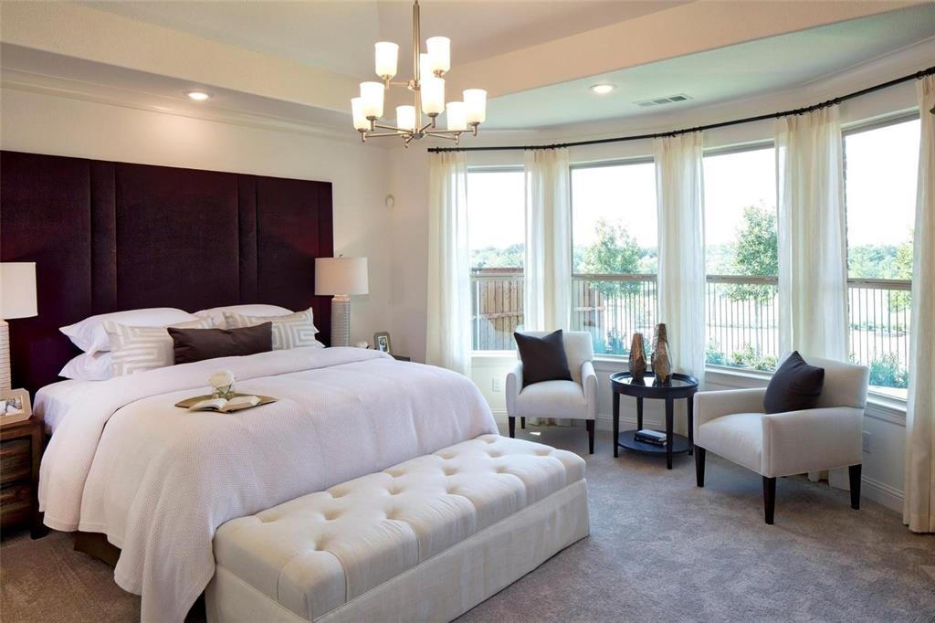 6825 Entwistle Road Frisco, TX 75034 - Photo 8 of 33 a spacious bedroom with a bed and ceiling fan