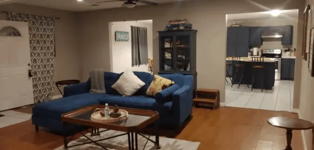 a living room with furniture and a rug