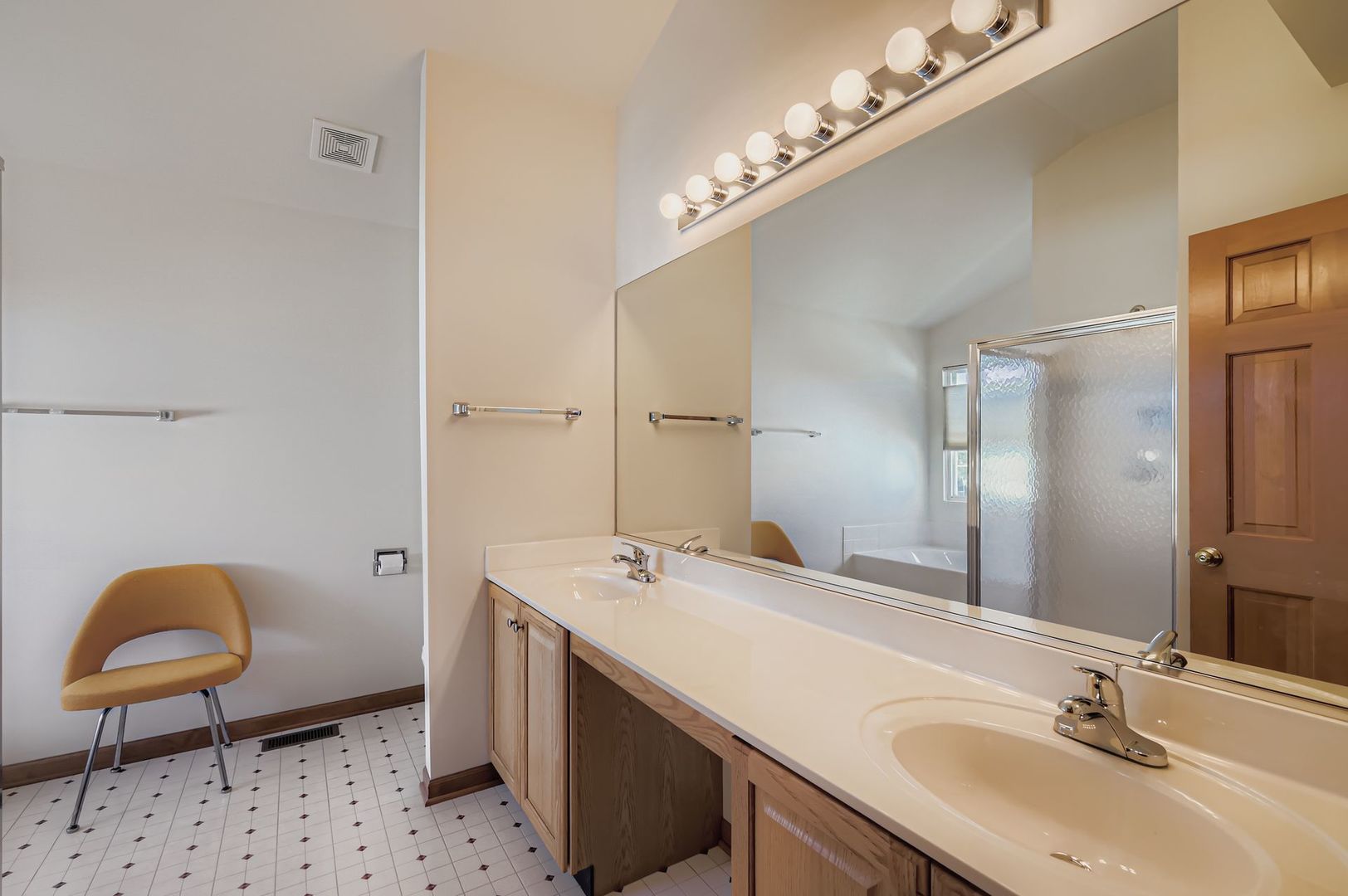 1920 Butler Drive Bartlett, IL 60103 - Photo 18 of 27 a bathroom with a double vanity sink mirror and toilet