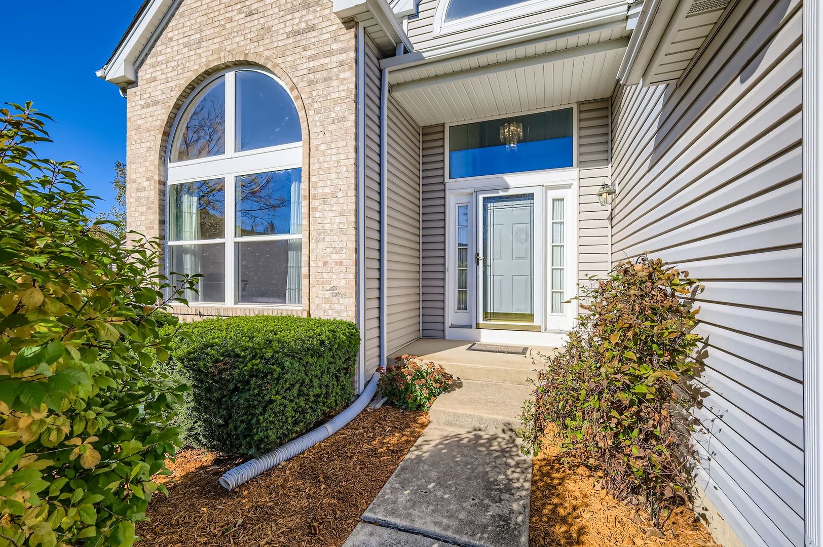 1920 Butler Drive Bartlett, IL 60103 - Photo 2 of 27 a front view of a house with garden