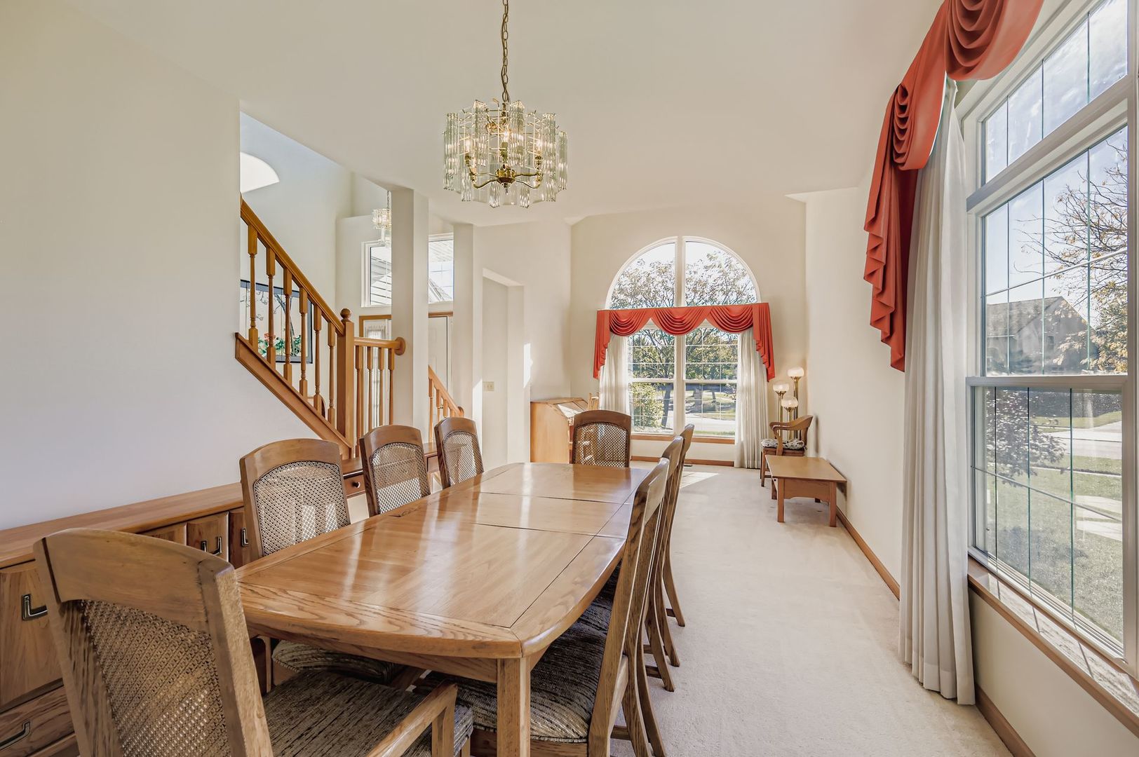 1920 Butler Drive Bartlett, IL 60103 - Photo 8 of 27 a view of a dining room with furniture a chandelier and large windows