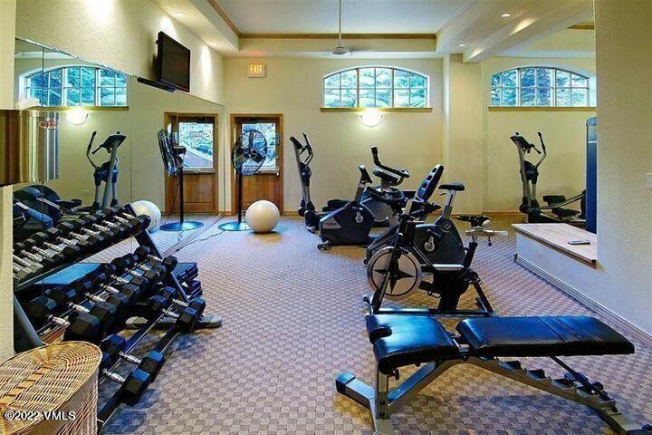 210 Offerson Road, Unit 10833 Beaver Creek, CO 81620 - Photo 13 of 16 a room with lots of chairs and mirrors