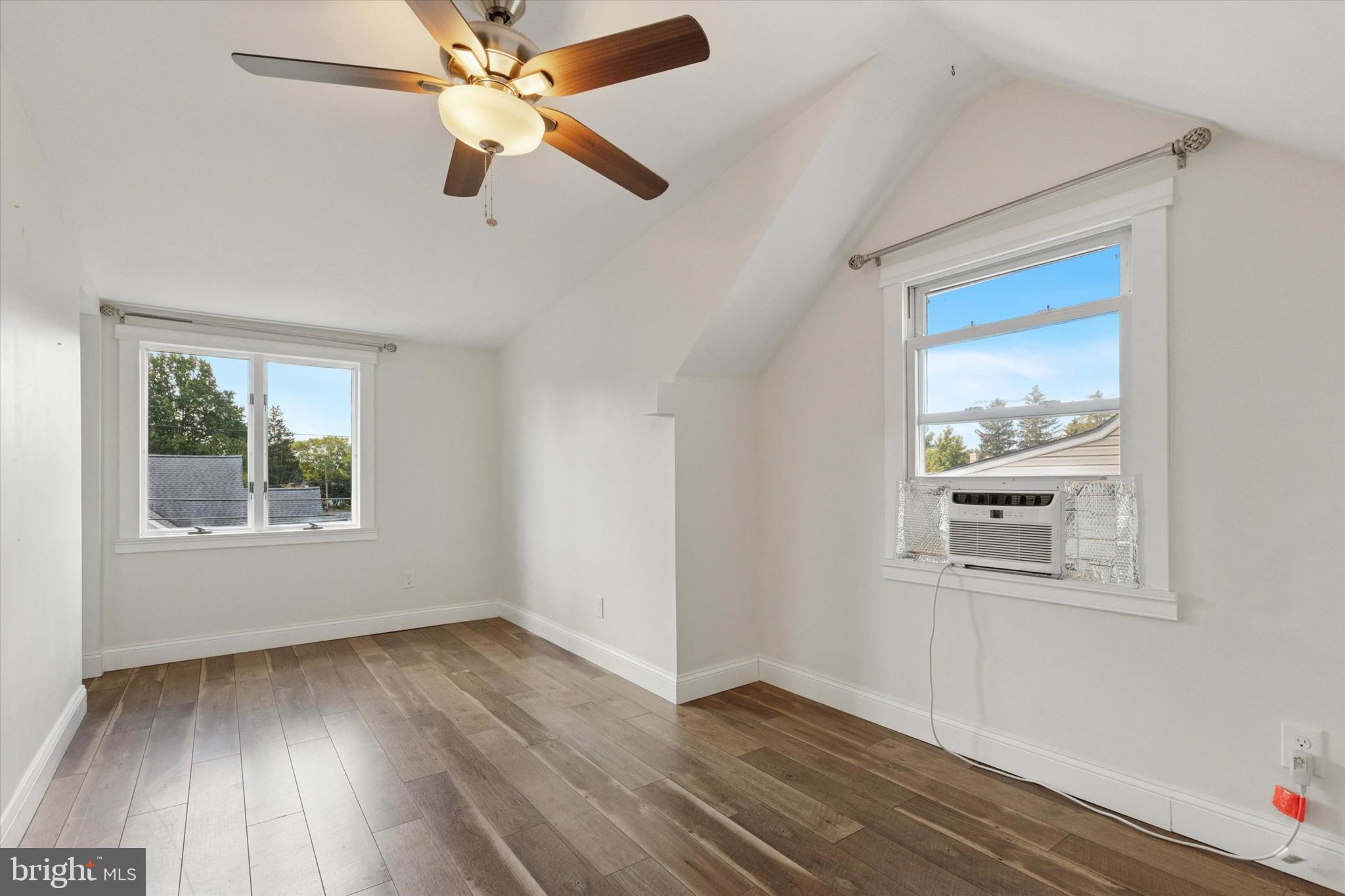 404 Exton Road Hatboro, PA 19040 - Photo 12 of 25 a view of an empty room with wooden floor and a window