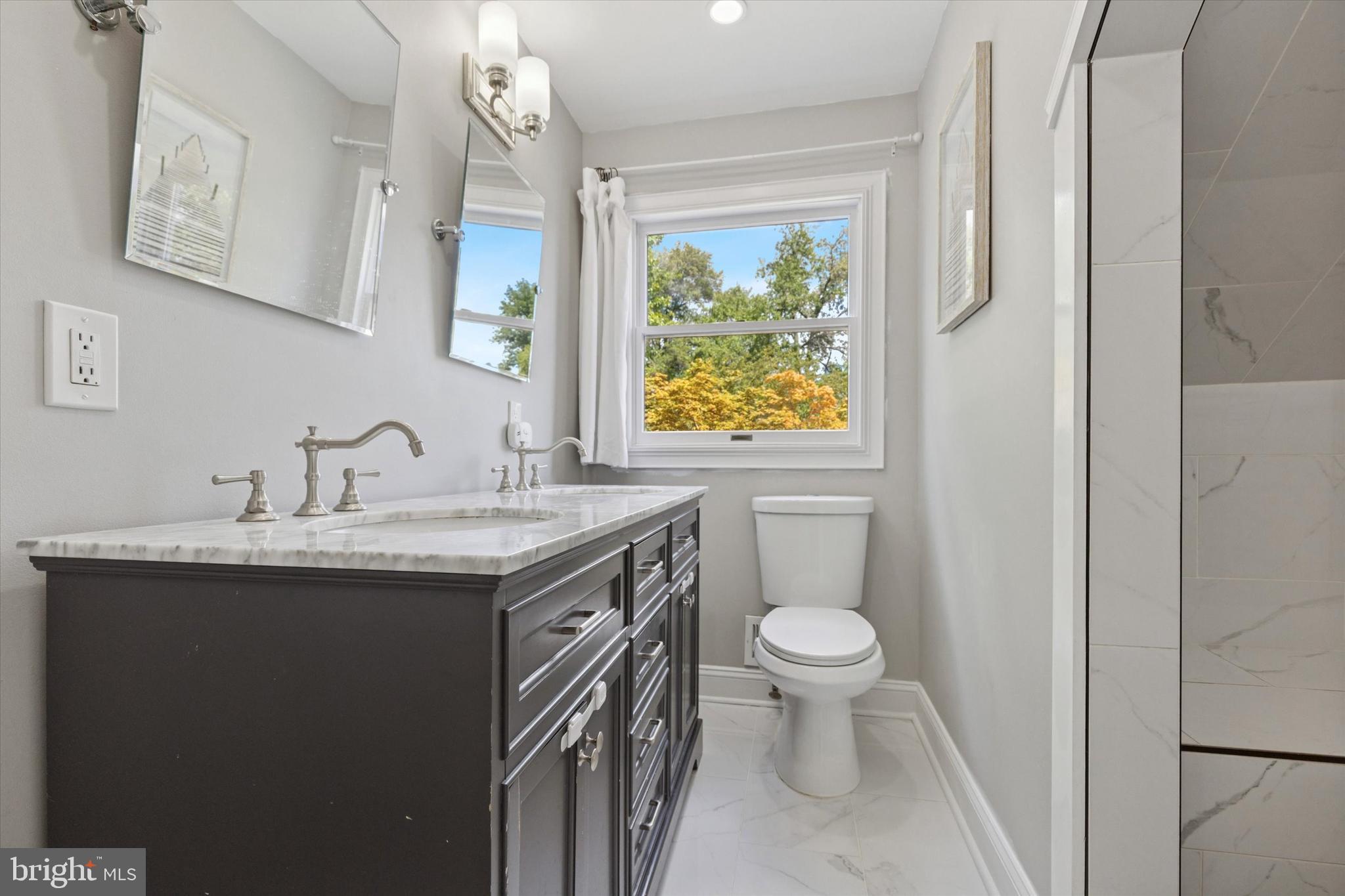 404 Exton Road Hatboro, PA 19040 - Photo 15 of 25 a bathroom with a granite countertop sink toilet and a mirror