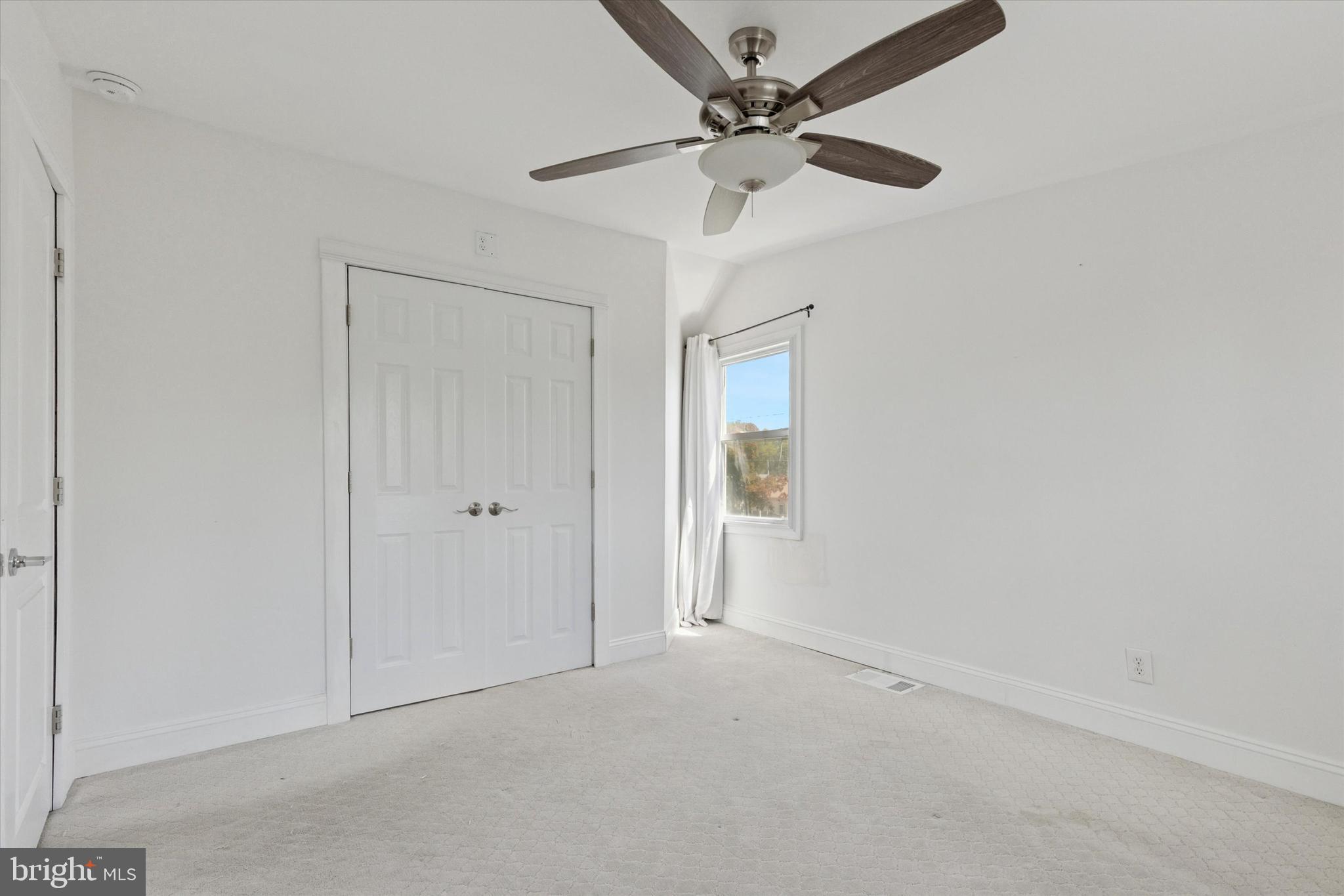 404 Exton Road Hatboro, PA 19040 - Photo 18 of 25 an empty room with a chandelier fan
