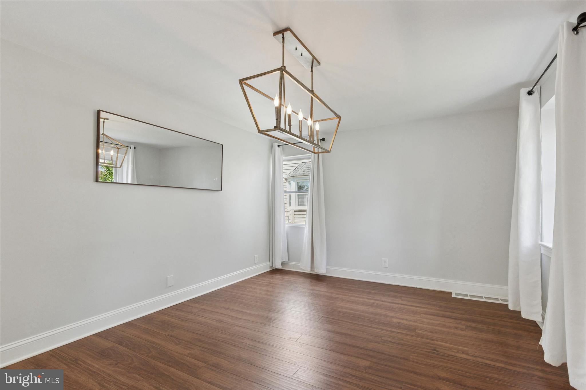 404 Exton Road Hatboro, PA 19040 - Photo 5 of 25 a view of a hallway with wooden floor and staircase