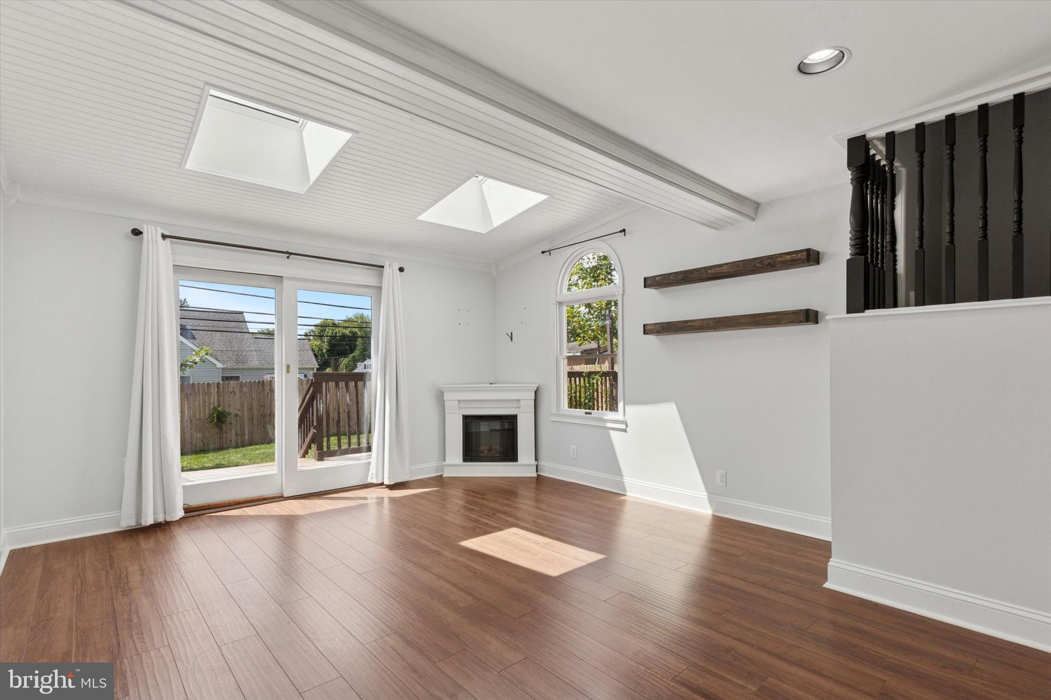 404 Exton Road Hatboro, PA 19040 - Photo 7 of 25 wooden floor in an empty room with a fireplace