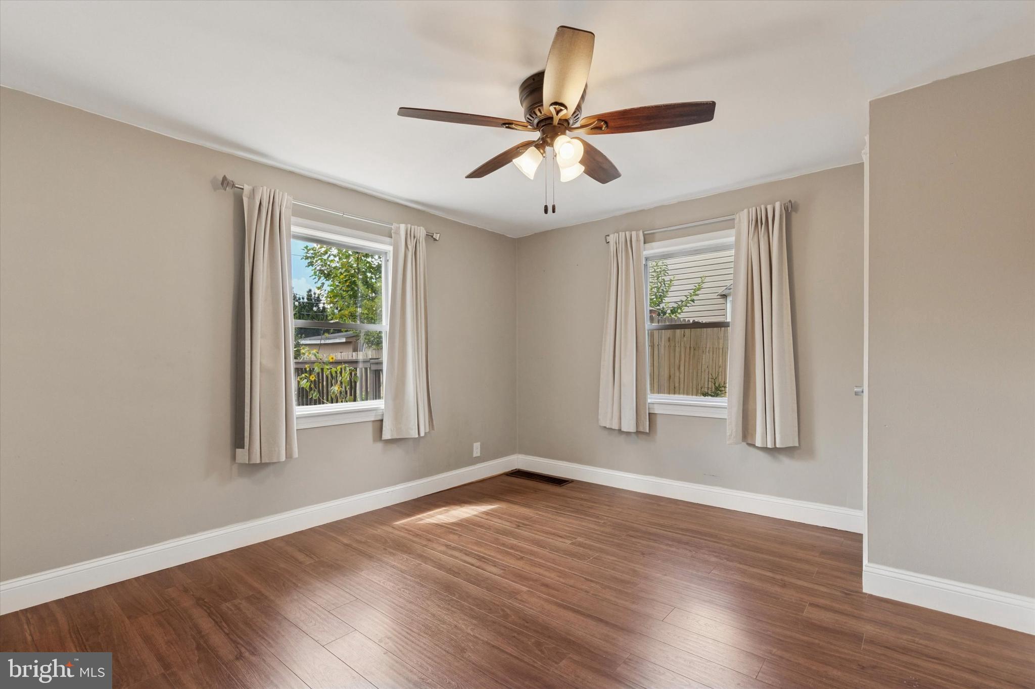 404 Exton Road Hatboro, PA 19040 - Photo 9 of 25 a view of empty room with wooden floor and fan