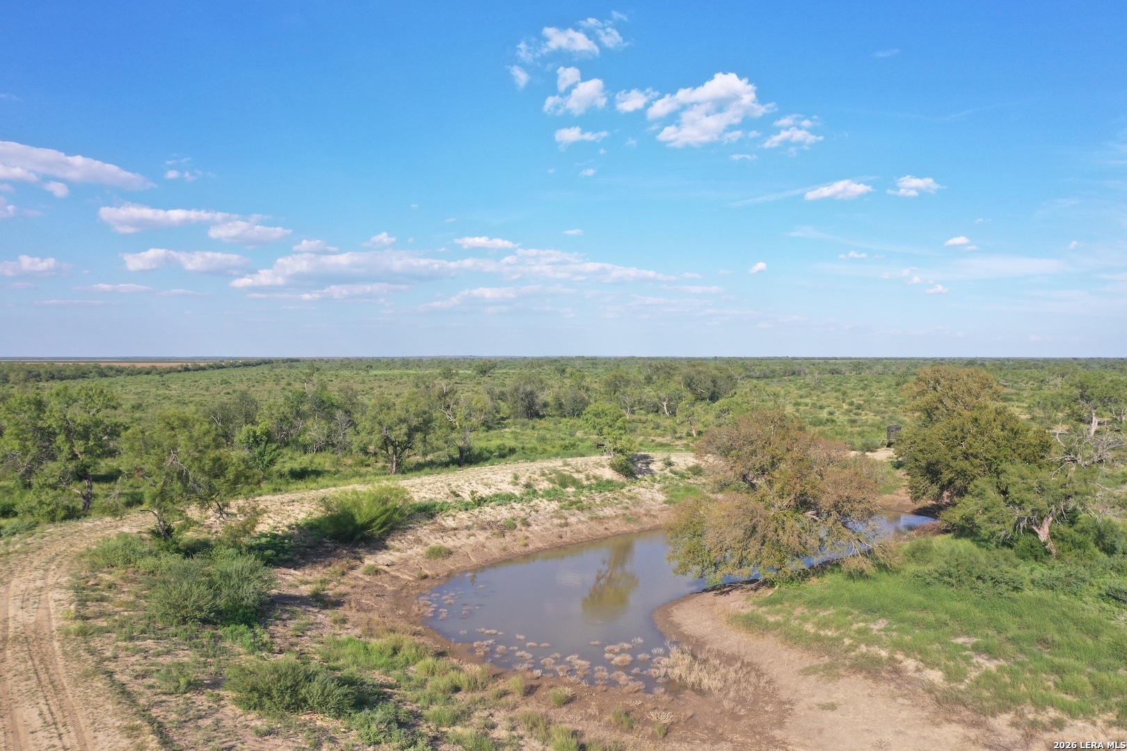 0 Fm 140 Pearsall, TX 78061 - Photo 6 of 28 a view of a lake with beach and city