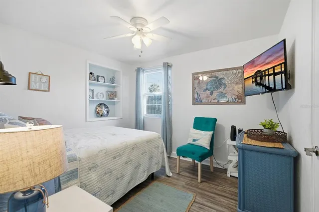 a bedroom with a bed and a chair