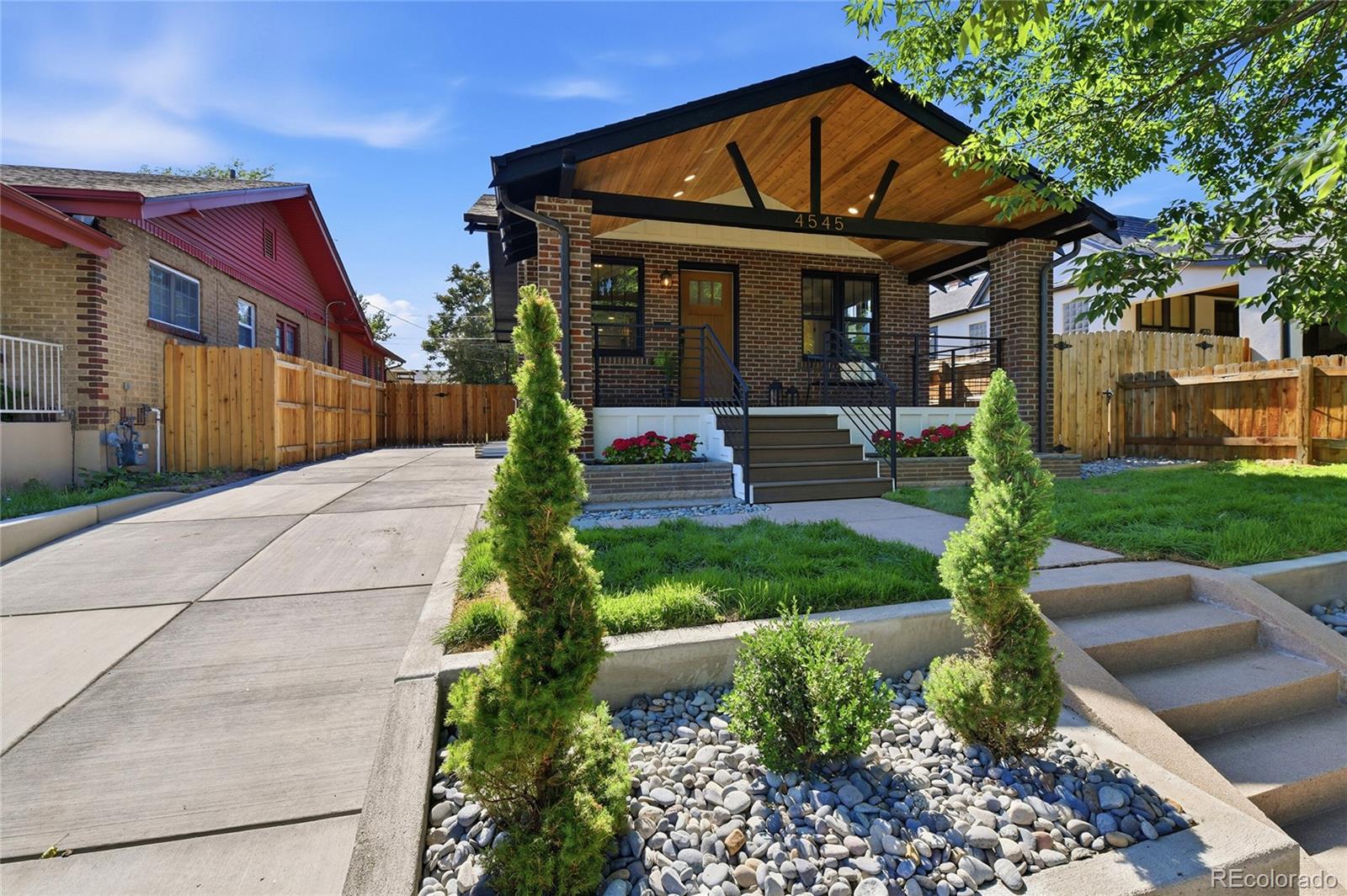4545 Decatur Street Denver, CO 80211 - Photo 2 of 30 a front view of a house with garden
