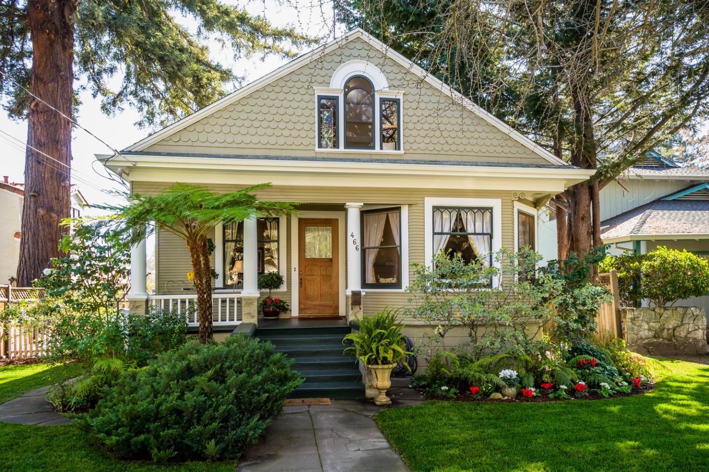 466 Ruthven Avenue Palo Alto, CA 94301 - Photo 1 of 12 a view of a white house next to a yard and large trees