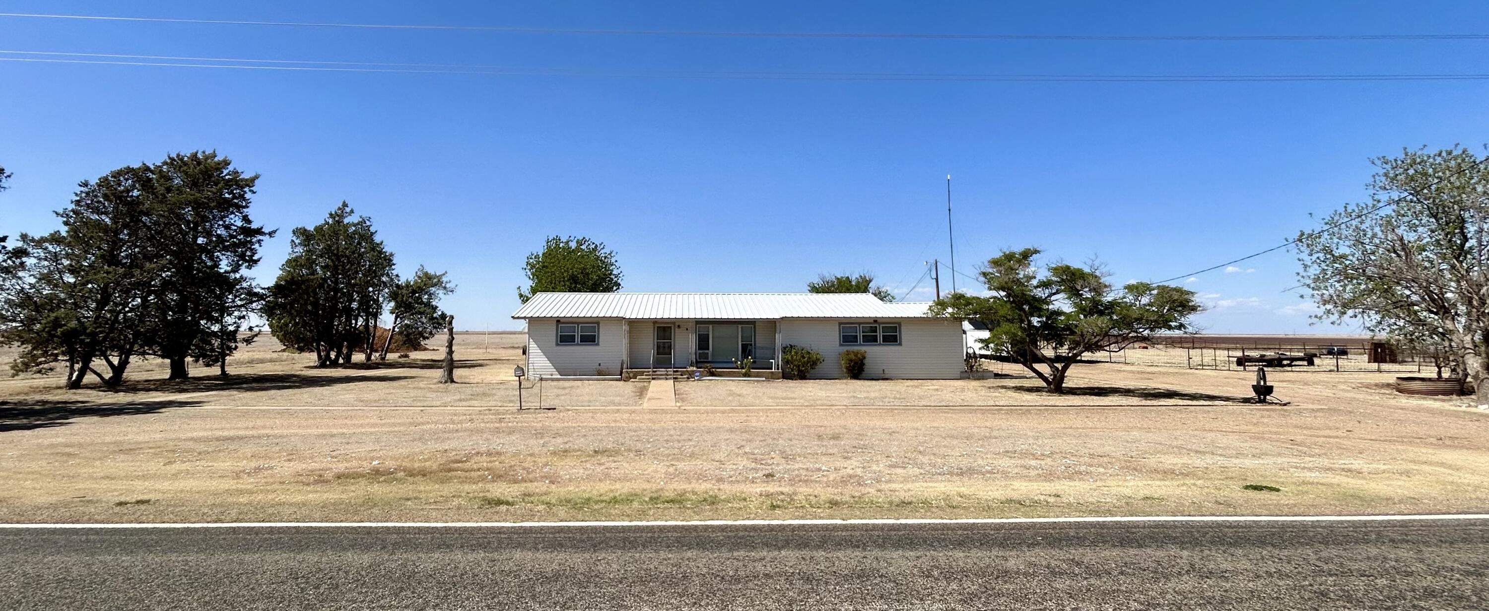 2101 Farm To Market 97 Lockney, TX 79241 - Photo 1 of 35 a view of a house with a snow on the road