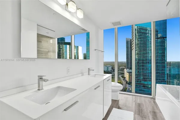a bathroom with a sink and a large mirror