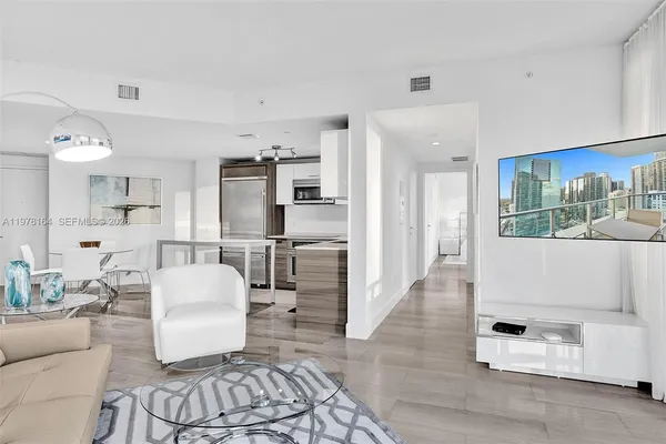 a living room with furniture and a rug