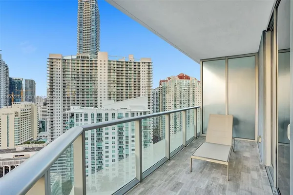 a view of balcony with wooden floor